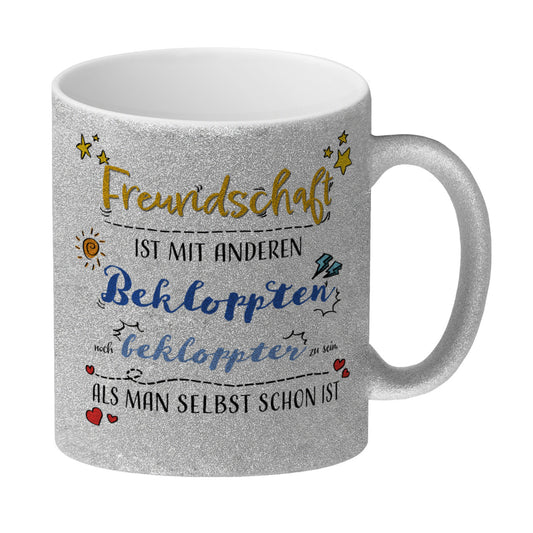 Freundschaft ist mit Anderen Bekloppten noch bekloppter zu sein als man selbst schon ist Glitzer-Kaffeebecher Der Kaffeebecher ist mit seiner schönen Optik und seinem Spruch eine schöner Hingucker. Es ist eine tolle Geschenkidee für deine besten Freunde,