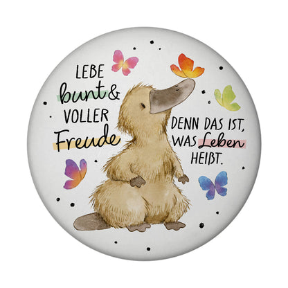 Schnabeltier Magnet rund mit Spruch Lebe bunt und freudig