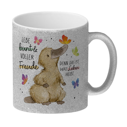 Schnabeltier Glitzer-Kaffeebecher mit Spruch Lebe bunt und freudig