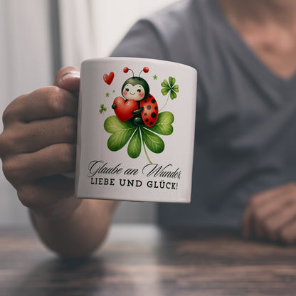 Marienkäfer Kaffeebecher mit Spruch Glaube an Wunder, Liebe und Glück!