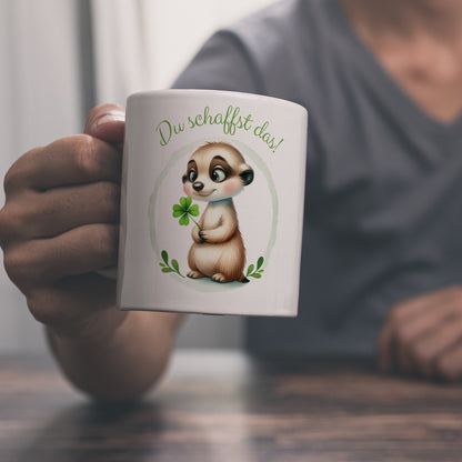 Erdmännchen mit Kleeblatt Kaffeebecher mit Spruch Du schaffst das