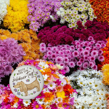 Dackel mit Blume Magnet rund mit Spruch Heute wird ein schöner Tag