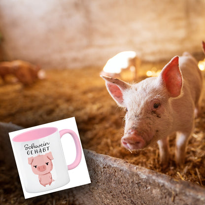 Ferkel Kaffeebecher in rosa mit Spruch Schwein gehabt