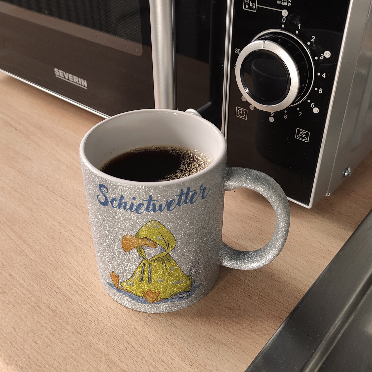 Möwe Glitzer-Kaffeebecher mit Spruch Schietwetter