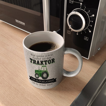 Traktor Glitzer-Kaffeebecher mit Spruch Kindheitsträume - Für immer Traktor fahren