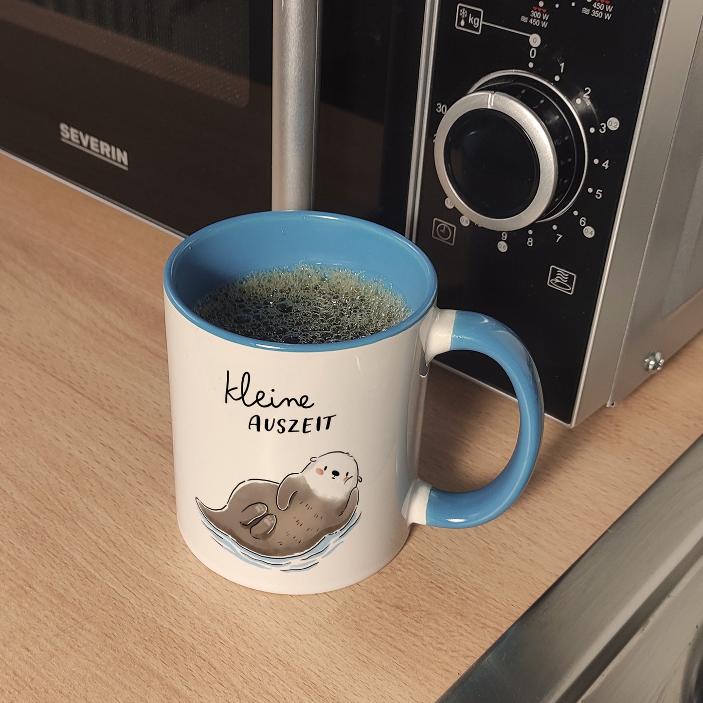 Otter Kaffeebecher in hellblau mit Spruch Kleine Auszeit