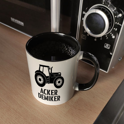 Traktor Kaffeebecher in schwarz mit Spruch Ackerdemiker