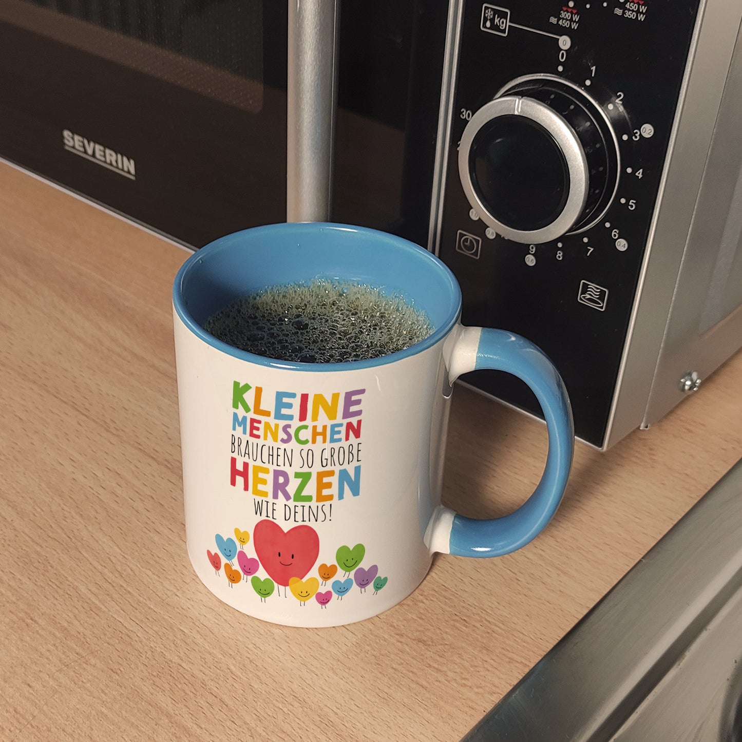 Herzen Kaffeebecher in hellblau mit Spruch Große Herzen für kleine Menschen