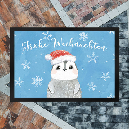 Pinguin mit Weihnachtsmütze Fußmatte XL in 40x60 cm in blau und Spruch Frohe Weihnachten