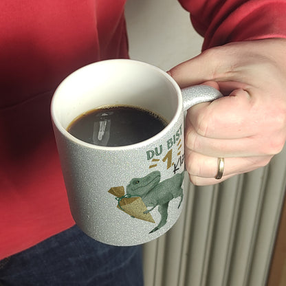 Dino mit Schultüte Glitzer-Kaffeebecher mit Spruch Du bist 1. Klasse!