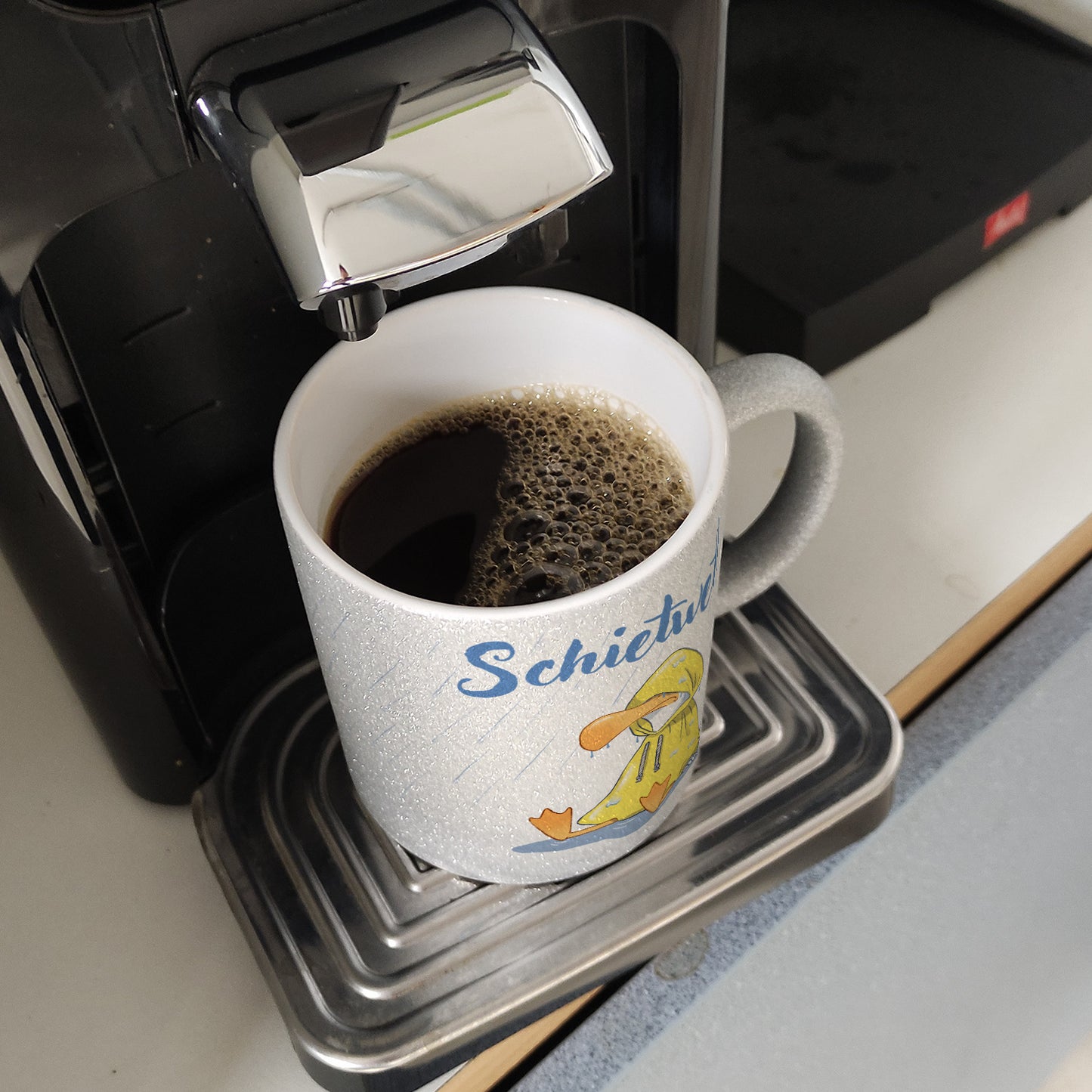 Möwe Glitzer-Kaffeebecher mit Spruch Schietwetter