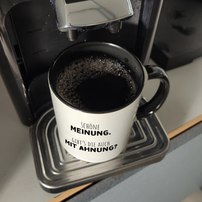 Klugscheißer Kaffeebecher in schwarz mit Spruch Schöne Meinung aber keine Ahnung