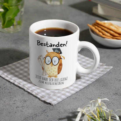 Bestandene Prüfung Eule Kaffeebecher mit Spruch Lizenz zum Klugscheißen