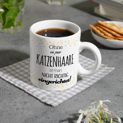 Ohne ein paar Katzenhaare ist man nicht richtig eingerichtet! Kaffeebecher