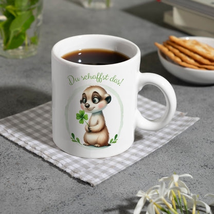 Erdmännchen mit Kleeblatt Kaffeebecher mit Spruch Du schaffst das